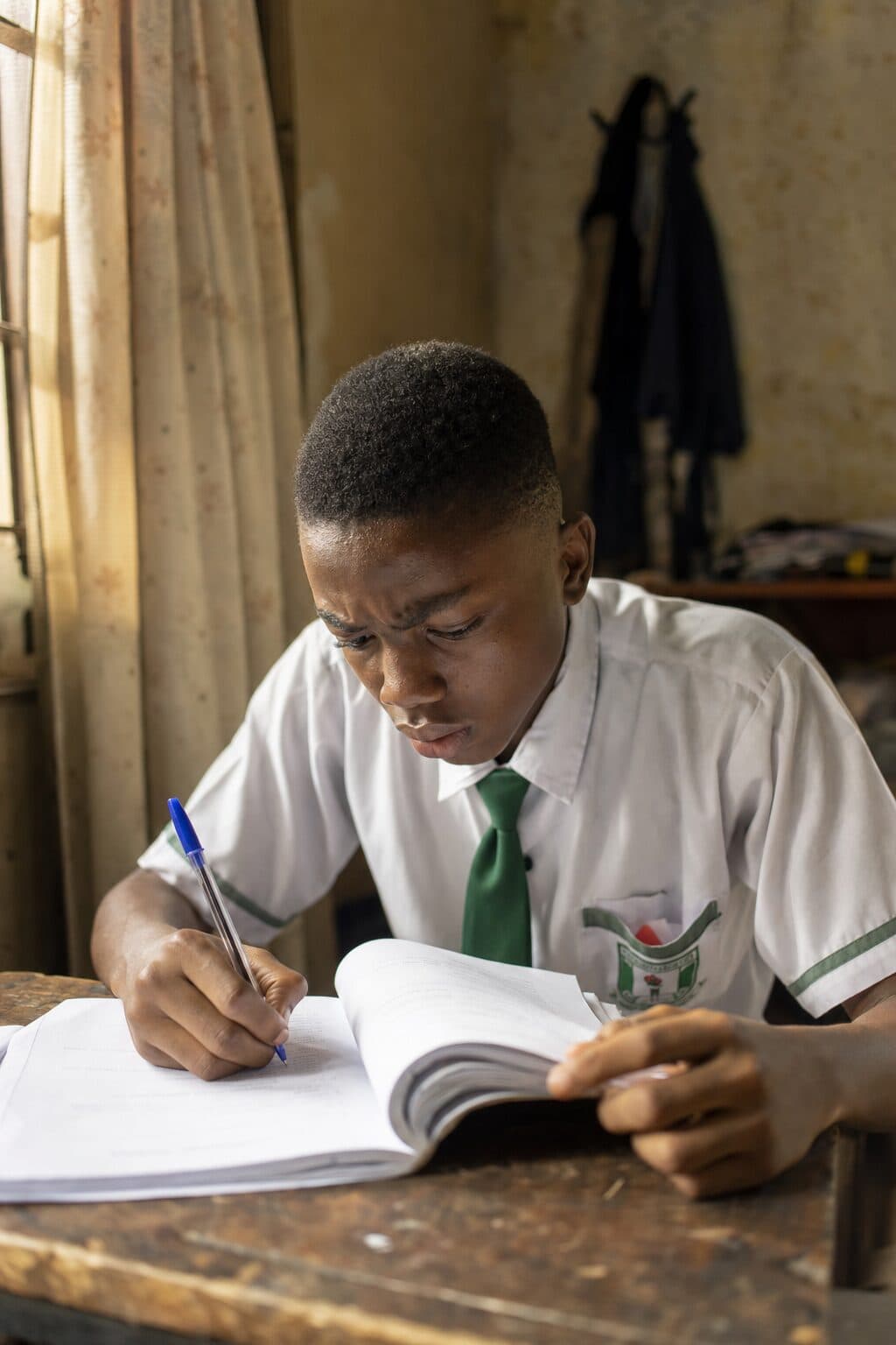 A Nigerian secondary school student working through JAMB past questions